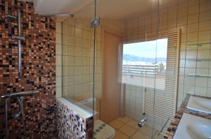 a bathroom with a shower and a toilet and a sink at RNET - Apartments Roses Centre in Roses +48 photos