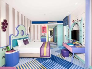 a childs bedroom with a bed and a desk at The Land Of Legends Kingdom Hotel - All-in Concept in Belek