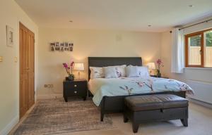 a bedroom with a large bed and a window at Dublin 'Home from Home', Luxury, Private Secure House in Dublin