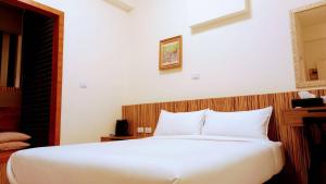 Voodi või voodid majutusasutuse Plum Green Homestay toas
