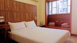 Voodi või voodid majutusasutuse Plum Green Homestay toas