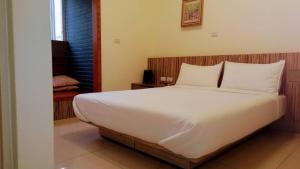 Voodi või voodid majutusasutuse Plum Green Homestay toas