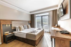 Postel nebo postele na pokoji v ubytování Misal Hotel Trabzon