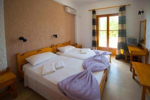 Postel nebo postele na pokoji v ubytování Marie Hotel
