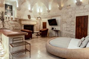 TV a/nebo společenská místnost v ubytování Pollicastro Boutique Hotel