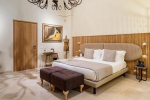 Postel nebo postele na pokoji v ubytování Pollicastro Boutique Hotel