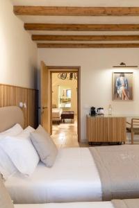Postel nebo postele na pokoji v ubytování Pollicastro Boutique Hotel
