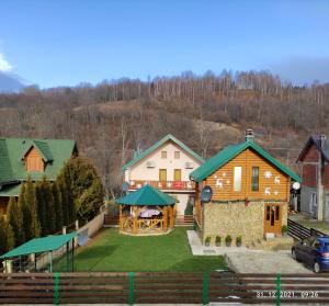 an aerial view of a house with a yard at Apartmani Vuk in Kolašin