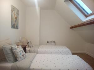 A bed or beds in a room at Fantastic four bedroom villa minutes from Disneyland Paris.