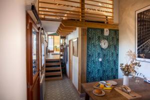 a hallway of a house with a table at LYONEST chambre d'hôtes in Lyon