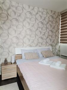 Postel nebo postele na pokoji v ubytování Sunčani Breg apartman 10