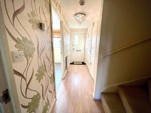 a hallway of a home with a hallway at Lakeside Stylish 3 Bedroom House in Grays Thurrock