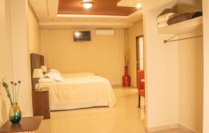 Orquidea Limon Hotel Boutique房間的床