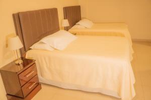 Orquidea Limon Hotel Boutique房間的床