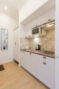 Kuchyň nebo kuchyňský kout v ubytování Scandinavian Apartments