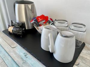 a black counter with three white containers on it at Smugglers Rest Bed & Breakfast in Whitby