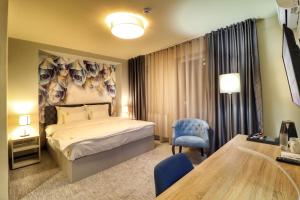 Postel nebo postele na pokoji v ubytování Hotel Skadarlija NB