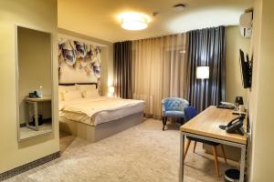 Postel nebo postele na pokoji v ubytování Hotel Skadarlija NB