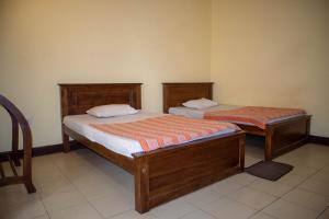 Postel nebo postele na pokoji v ubytování Chamaya Holiday Inn