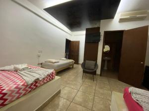Postel nebo postele na pokoji v ubytování Hotel Colonos Los Cabos