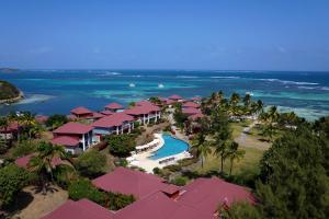 an aerial view of a resort with a swimming pool at Les Villas du Lagon in Le François