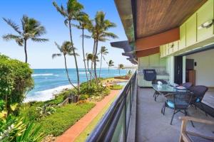 a balcony of a house with a view of the ocean at Luxury 2-Story Oceanfront Condo w/ Views & Pool in Wailua