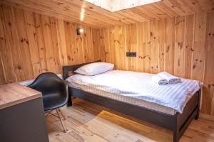 מיטה או מיטות בחדר ב-Apartment Skyta Krasnyk