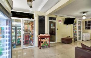 a room with a store with glass doors at Family 2 Bedroom Apartment in Corales del Sur in La Viva