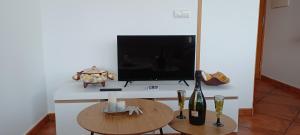 Televízia a/alebo spoločenská miestnosť v ubytovaní Loft Turístico