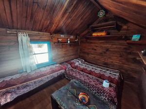 En eller flere senge i et værelse på El Cusifai