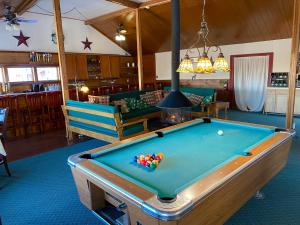 a pool table in the middle of a room at Bromley View Inn in Bondville