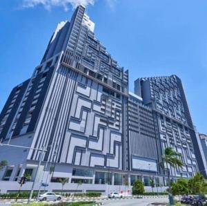 a large building with a geometric design on it at BotakCuteHomestay@Imperio Residence in Melaka