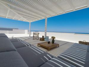 a living room with a couch and a table at Bite - Bike and Kite Accommodations in Trapani
