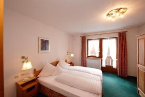 Posteľ alebo postele v izbe v ubytovaní Hotel Gridlon