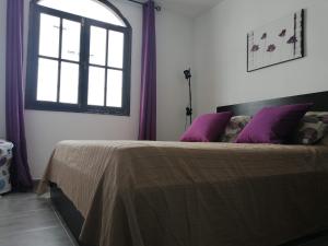 A bed or beds in a room at Amazing View Holiday Home near of the sea