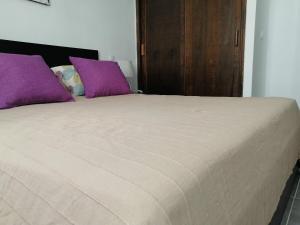 A bed or beds in a room at Amazing View Holiday Home near of the sea