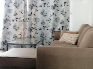A seating area at Amazing View Holiday Home near of the sea