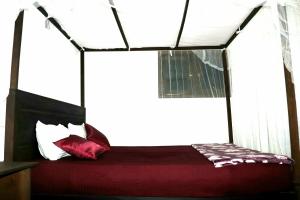 Letto o letti in una camera di Rainforest River Bay