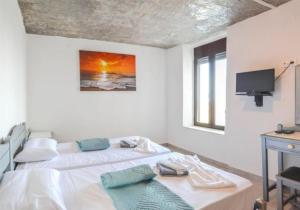 Villa Irena panoramic sea view tesisinde bir odada yatak veya yataklar