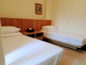 Voodi või voodid majutusasutuse Plum Green Homestay toas