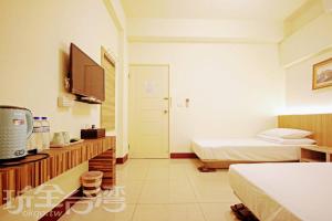 Voodi või voodid majutusasutuse Plum Green Homestay toas