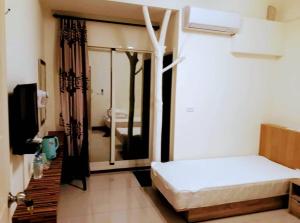 Voodi või voodid majutusasutuse Plum Green Homestay toas