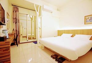 Voodi või voodid majutusasutuse Plum Green Homestay toas