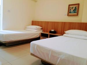 Voodi või voodid majutusasutuse Plum Green Homestay toas