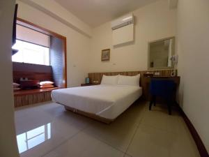 Voodi või voodid majutusasutuse Plum Green Homestay toas