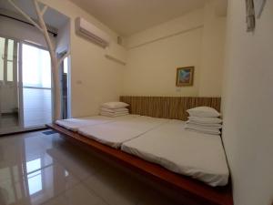 Voodi või voodid majutusasutuse Plum Green Homestay toas