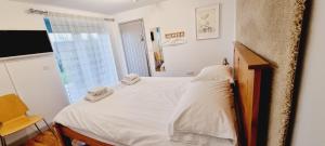 En eller flere senger på et rom på B - Simply Rooms