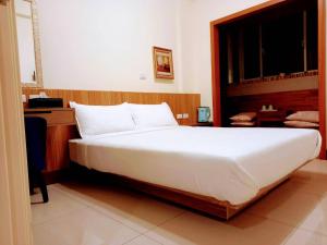 Voodi või voodid majutusasutuse Plum Green Homestay toas