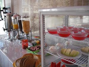 an open refrigerator filled with food and other foods at Antonis Hotel in Kefalos