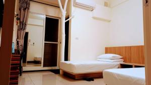 Voodi või voodid majutusasutuse Plum Green Homestay toas
